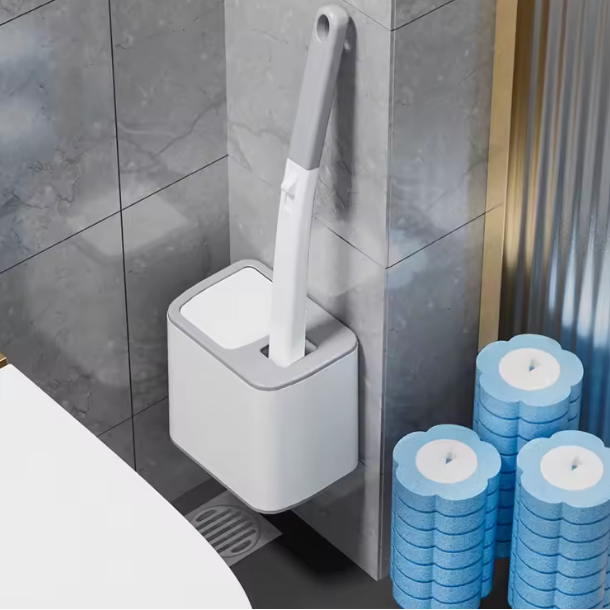 Cleaning brush with holder and replacement heads in a bathroom setting